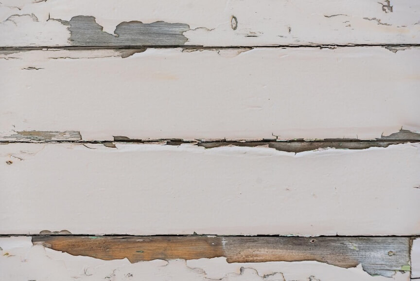 Severely damaged rotten fascia board showing wood decay and structural damage